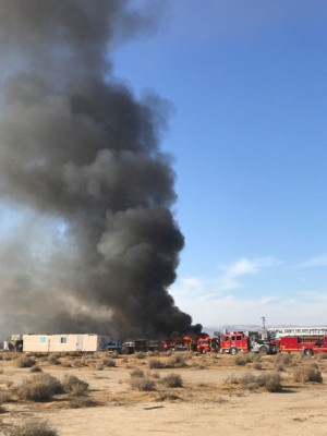 A fire structure fire burns near Antelope Acres at 40th Street West and Avenue C in Lancaster. Los Angeles County Fire Department responded to the scene. [Photo by Jeff Zimmerman]