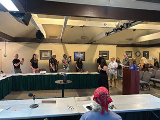 Elected directors being sworn in 