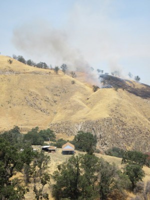 Homes in Digier Canyon seen below the fire burn area. [photo by Gary Meyer, The Mountain Enterprise]