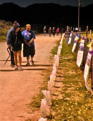 Families review 2014 Relay for Life luminaries [photo by Patric Hedlund]