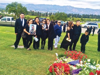 Martinez' family at his funeral. Nelson Martinez died instantly May 13 when a five ton Hall Ambulance Service truck with its engine running was taken by Kristina Foss Fort. The panicked woman suffering repetitive seizures was fleeing EMTs when she collided with Martinez’ truck. [photo by Patric Hedlund]