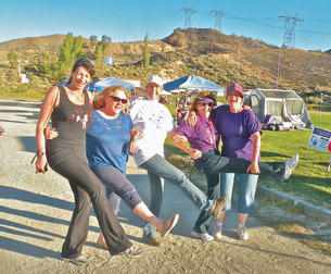 Left: We might be tempted to call this crew the Relay Rockettes, but they are part of the ‘One Year Better’ Team doing their shift at the phenomenally successful 2013 Mountain Communities Relay For Life (l-r) Lois Lopez, Cam Acosta, Teresa Dyer, KayChilano and Sue Smashey (from Karen Schott’s team). [photo by Patric Hedlund]