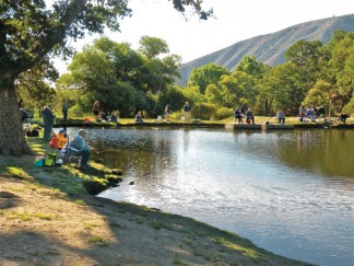 Frazier Mountain Park is the jewel at the heart of the Mountain Communities, the center of the original settlement. Above: at the Fiesta Days Fishing Derby two years ago. The park is a center of family activity for many who live in this area. Now residents are asked to help plan for updates. [photo by Patric Hedlund]