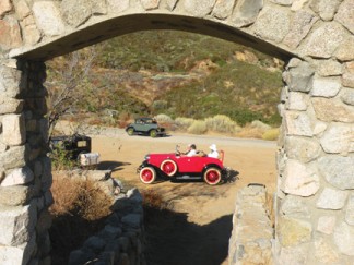 Above: The Model A Club seen through the stone archway of the Tumble Inn ruins on the Ridge Route in 2010 [photo by Patric Hedlund]