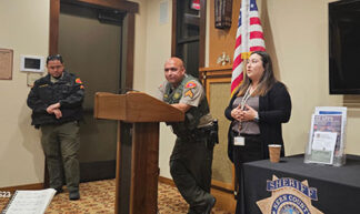 Sergeant Salvador Orona and KCSO Public Information Officer Lori Meza speaking at the meeting