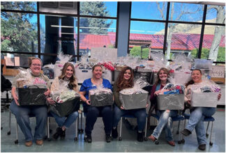 Administration and volunteers after assembling baskets.