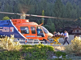The cyclist was transported to Hall's medevac helicopter. Double click on photo to enlarge.  [Patric Hedlund photo for The Mountain Enterprise]