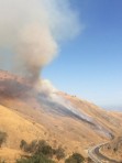Wildfire heads up slopes toward Digier Canyon