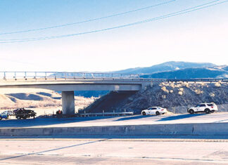 A day-time December 18 photo of a different crash at the over-crossing on the Lebec Curve