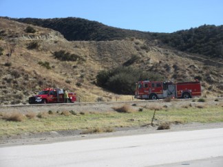 Los Angeles County Fire Department at the spot where a white powder substance was reported on northbound Interstate 5 just north of Smokey Bear Road. [photo by Gary Meyer, The Mountain Enterprise]