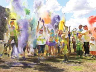 Joy and mischief were on bright display at the grand finale of the Color the Mountain 5k Fun Run Saturday, Sept. 20 in Frazier Mountain Park. Fountains of color flew into the air. [photo by Patric Hedlund]