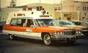 An early-model station wagon operated by Hall Ambulance Service